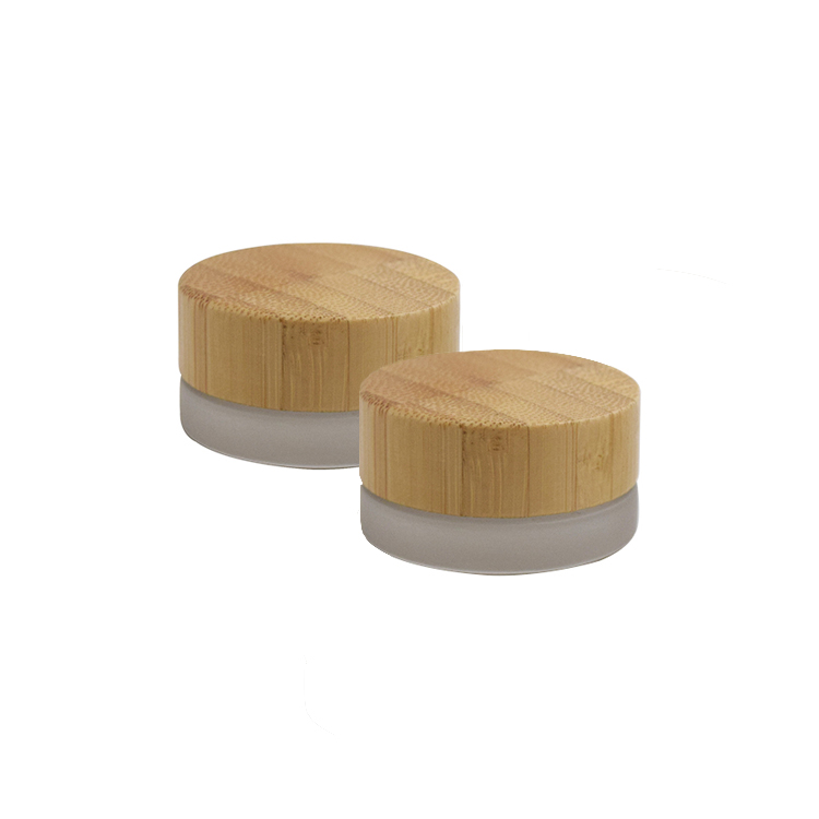 Hot sale eco friendly custom logo 5g 15g 30g 50g 100g frosted cosmetic glass cream jars with engraving bamboo lid