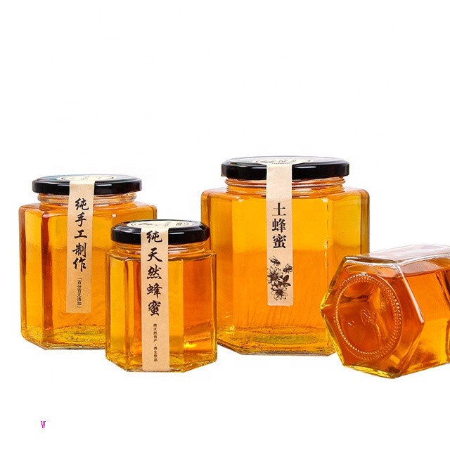 Hot sale empty small to large glass honey jar new design honey packing hexaganal storage jar for sale