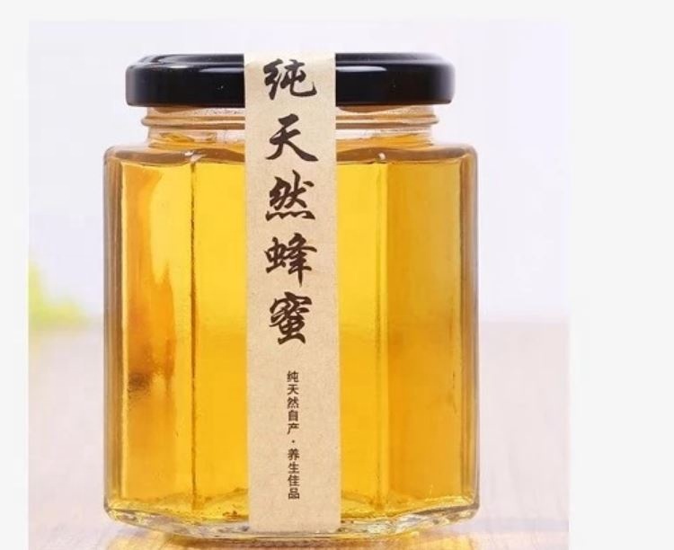 Hot sale empty small to large glass honey jar new design honey packing hexaganal storage jar for sale