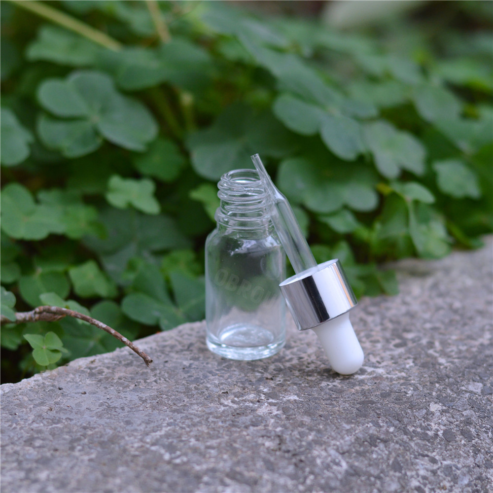 Hot sale essential oil e liquid 1 oz 30ml clear round glass dropper bottle with silver cap