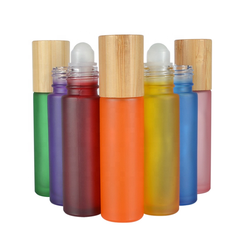 Hot sale essential oil luxury 10ml clear pink black green blue roll on glass bottle with bamboo cap
