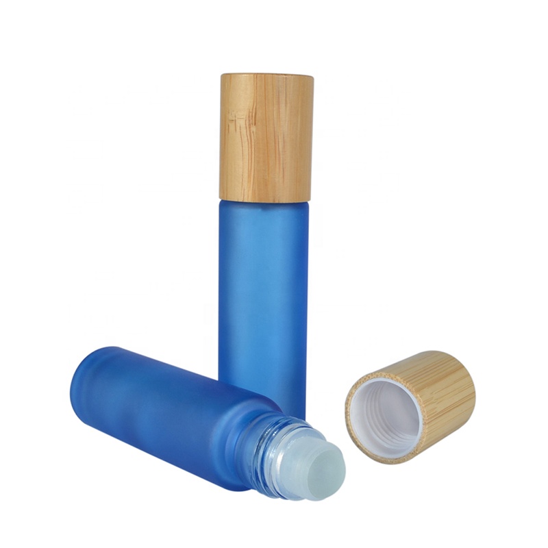 Hot sale essential oil luxury 10ml clear pink black green blue roll on glass bottle with bamboo cap