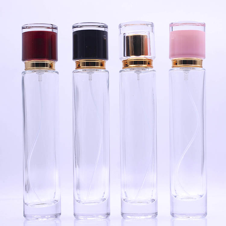 Hot sale height perfume 50ml glass bottle with gold pump and different color cap