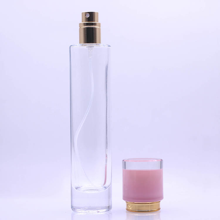 Hot sale height perfume 50ml glass bottle with gold pump and different color cap
