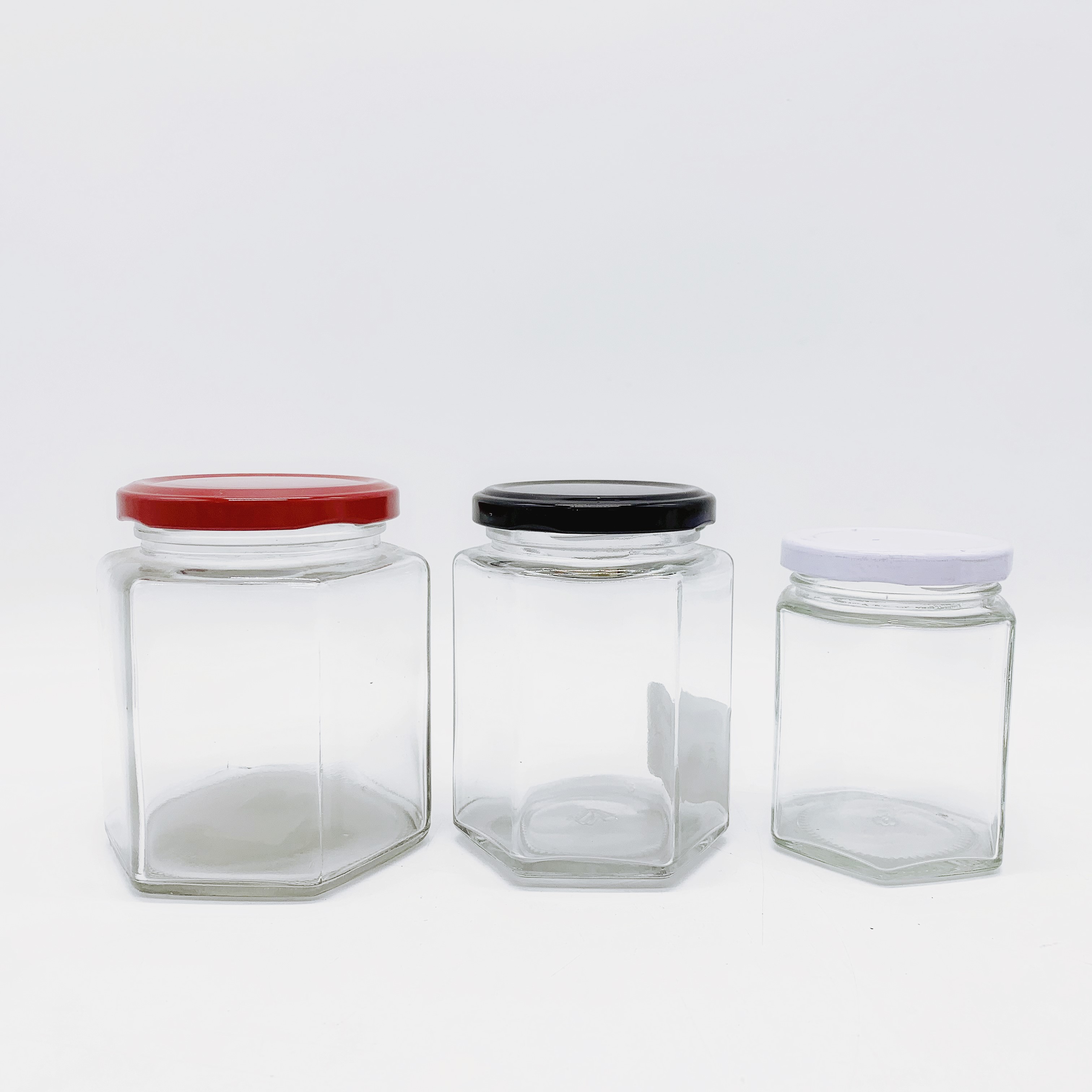 Hot sale high quality Hexagon glass honey jars with Metal Lid
