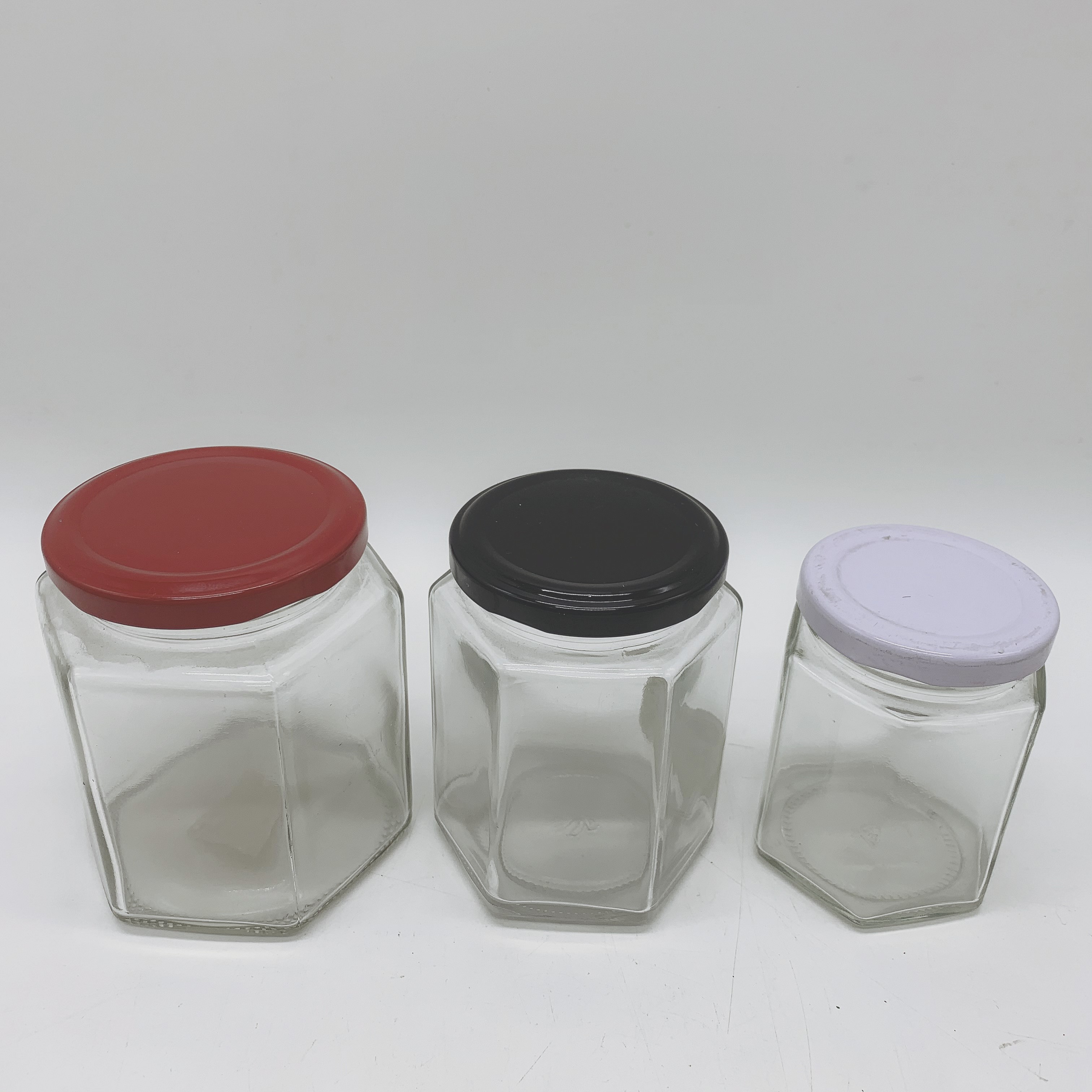 Hot sale high quality Hexagon glass honey jars with Metal Lid