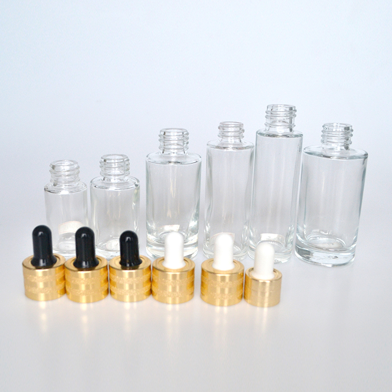Hot sale luxury 30ml 50ml 60ml 100ml clear flat shoulder cosmetic beauty essential oil glass dropper bottle with gold cap