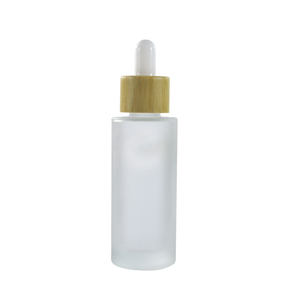 Hot sale luxury bamboo cosmetic packaging 30ml 50ml 100ml frosted clear glass bottle with bamboo caps