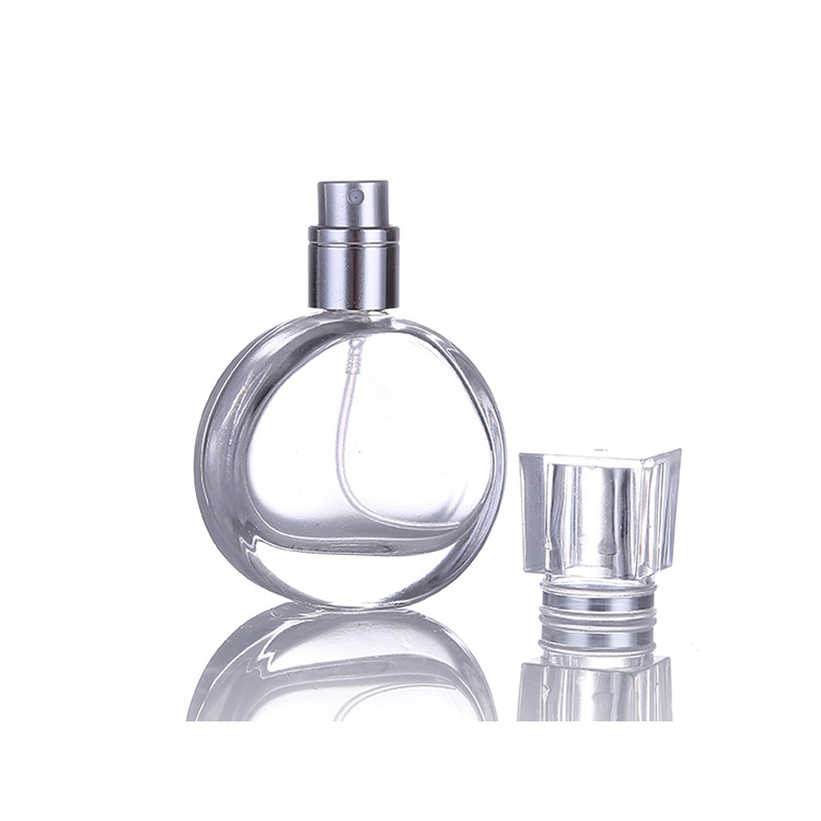 Hot sale woman use crimping pump glass perfume bottle 25ml round shape perfume bottle white color