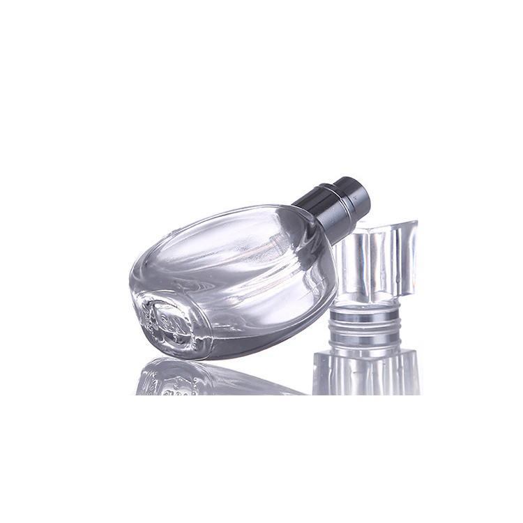 Hot sale woman use crimping pump glass perfume bottle 25ml round shape perfume bottle white color