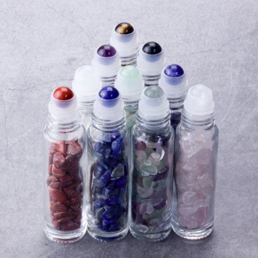 Hot sales 2020 clear glass roller ball bottles 10ml with crystal gem stones for essential oil