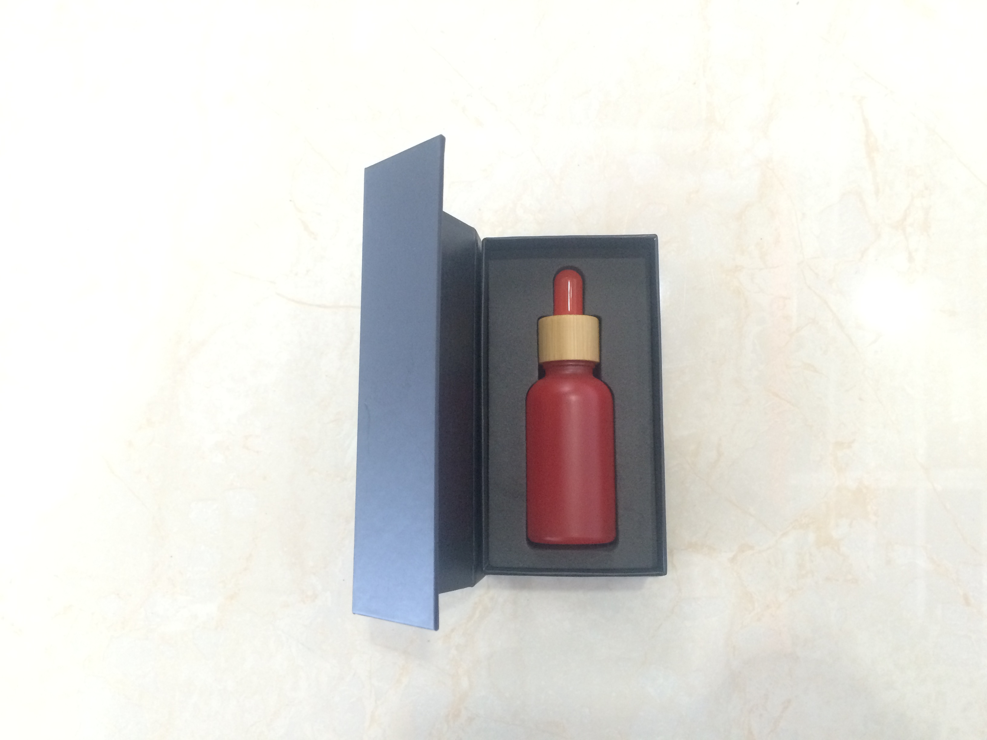 Hot sales 30ml colorful glass dropper bottle with bamboo cap and customized Paper box and tube with stocks