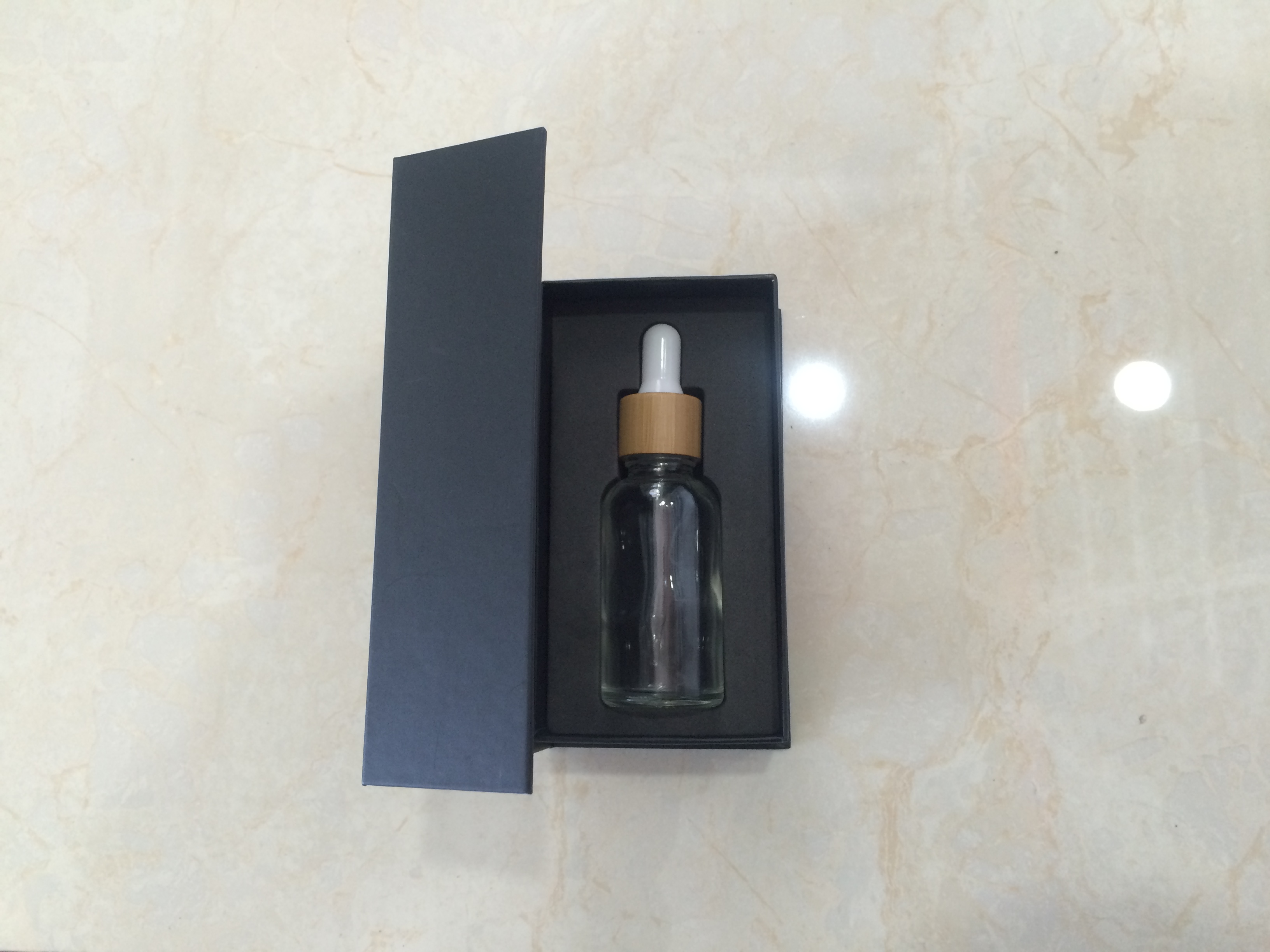 Hot sales 30ml colorful glass dropper bottle with bamboo cap and customized Paper box and tube with stocks