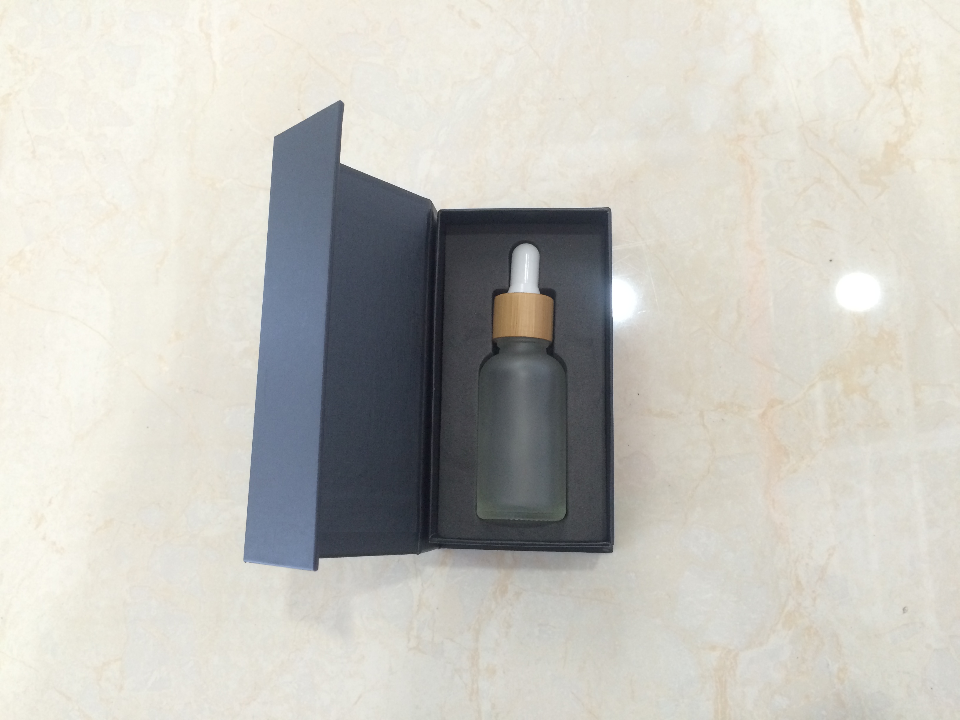 Hot sales 30ml colorful glass dropper bottle with bamboo cap and customized Paper box and tube with stocks