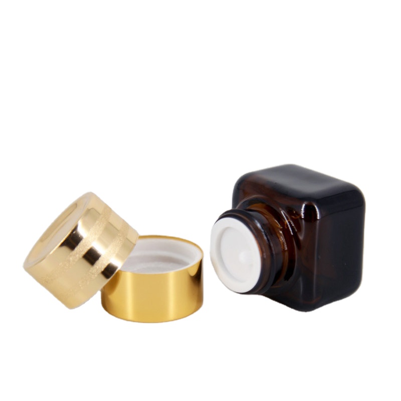 Hot sales cosmetic bottles mini square clear or brown glass cream jars lotion box with gold lids
