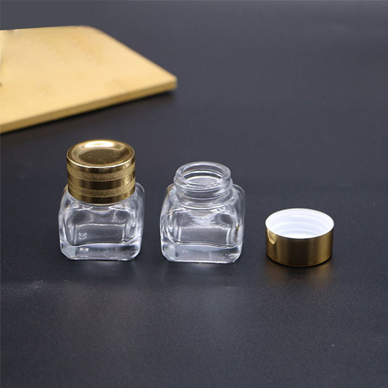 Hot sales cosmetic bottles mini square clear or brown glass cream jars lotion box with gold lids