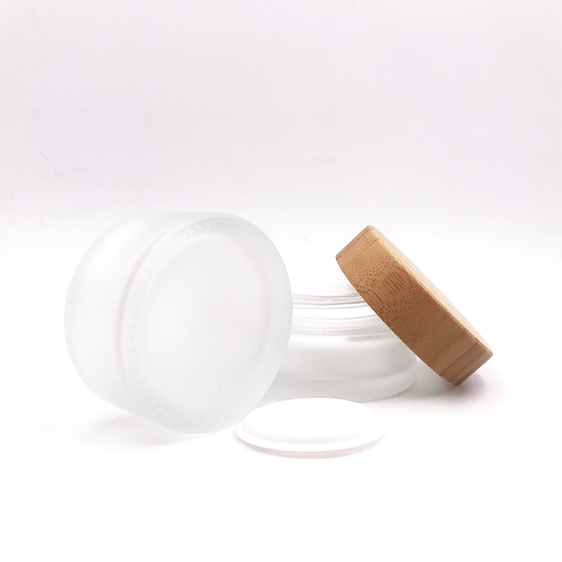 Hot sales frosted empty glass cosmetic jar with wooden/bamboo lid for packaging