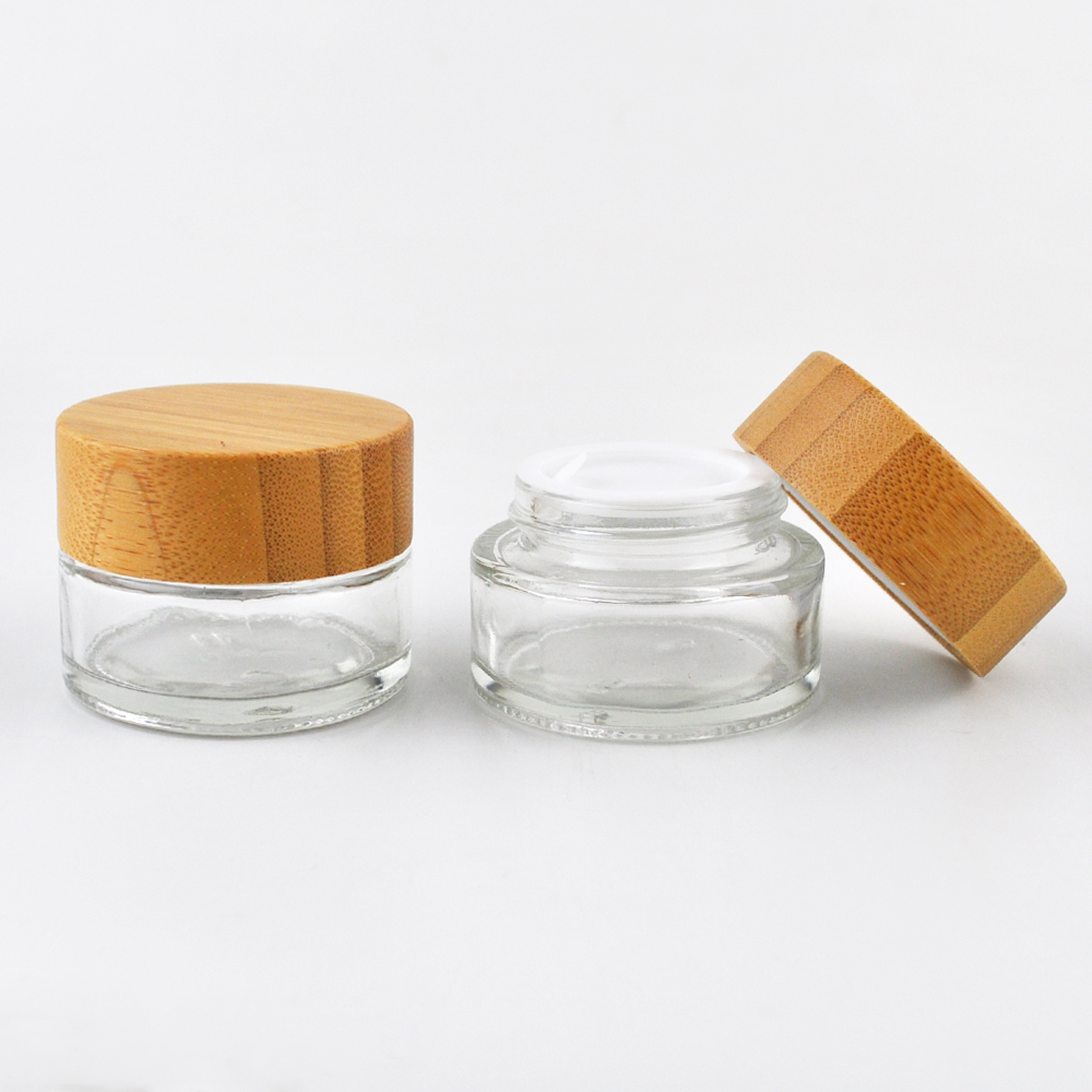 Hot sell 1oz 2oz clear frost glass container cosmetic empty face cream jar with wooden screw cap