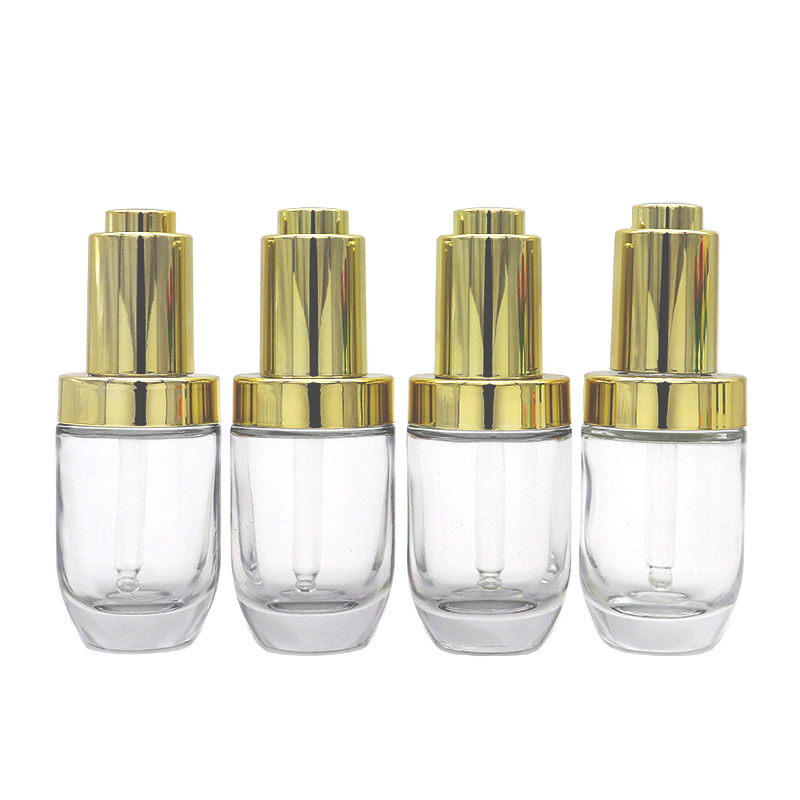 Hot sell empty transparent press dropper bottle 30ml push button serum bottle glass with golden cap pipette