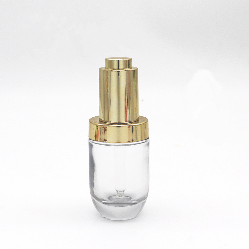 Hot sell empty transparent press dropper bottle 30ml push button serum bottle glass with golden cap pipette