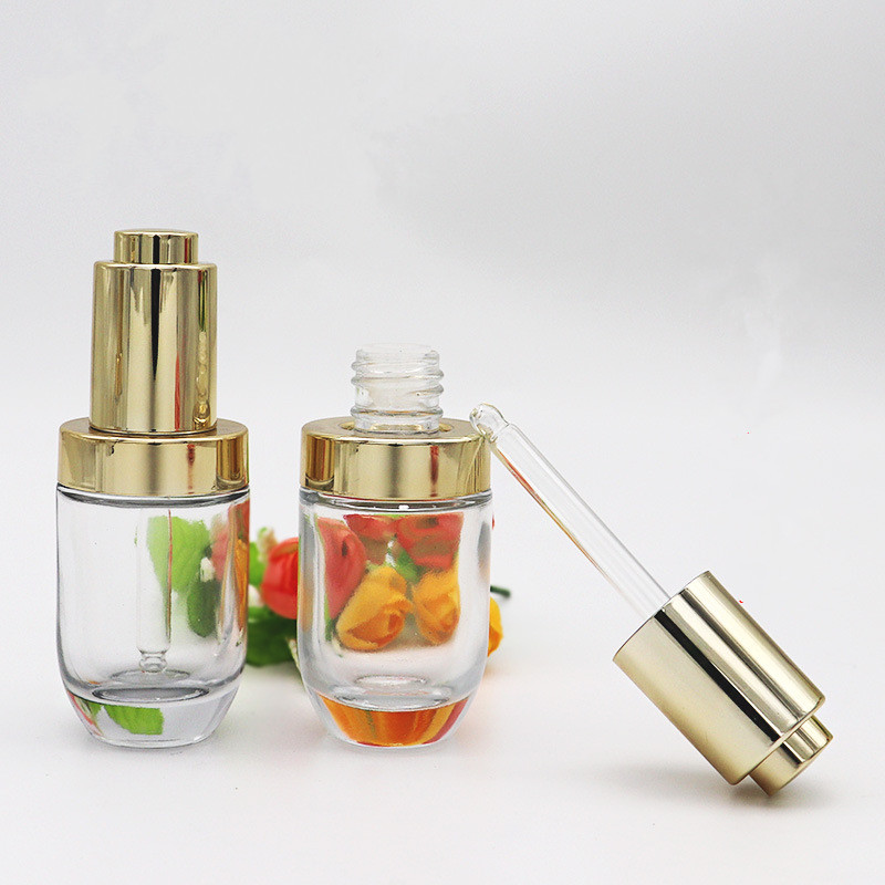 Hot sell empty transparent press dropper bottle 30ml push button serum bottle glass with golden cap pipette