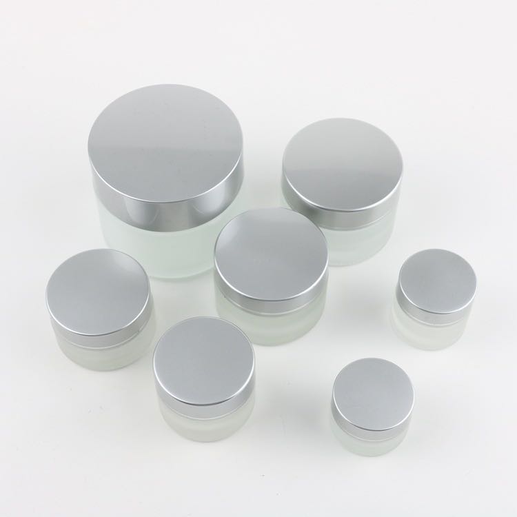 Hot sell fashionable fancy cosmetics 100g clear frosted glass cream jar with silver lids