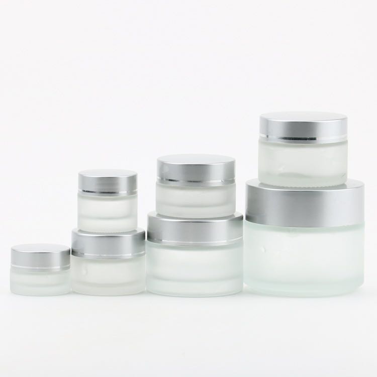 Hot sell fashionable fancy cosmetics 100g clear frosted glass cream jar with silver lids