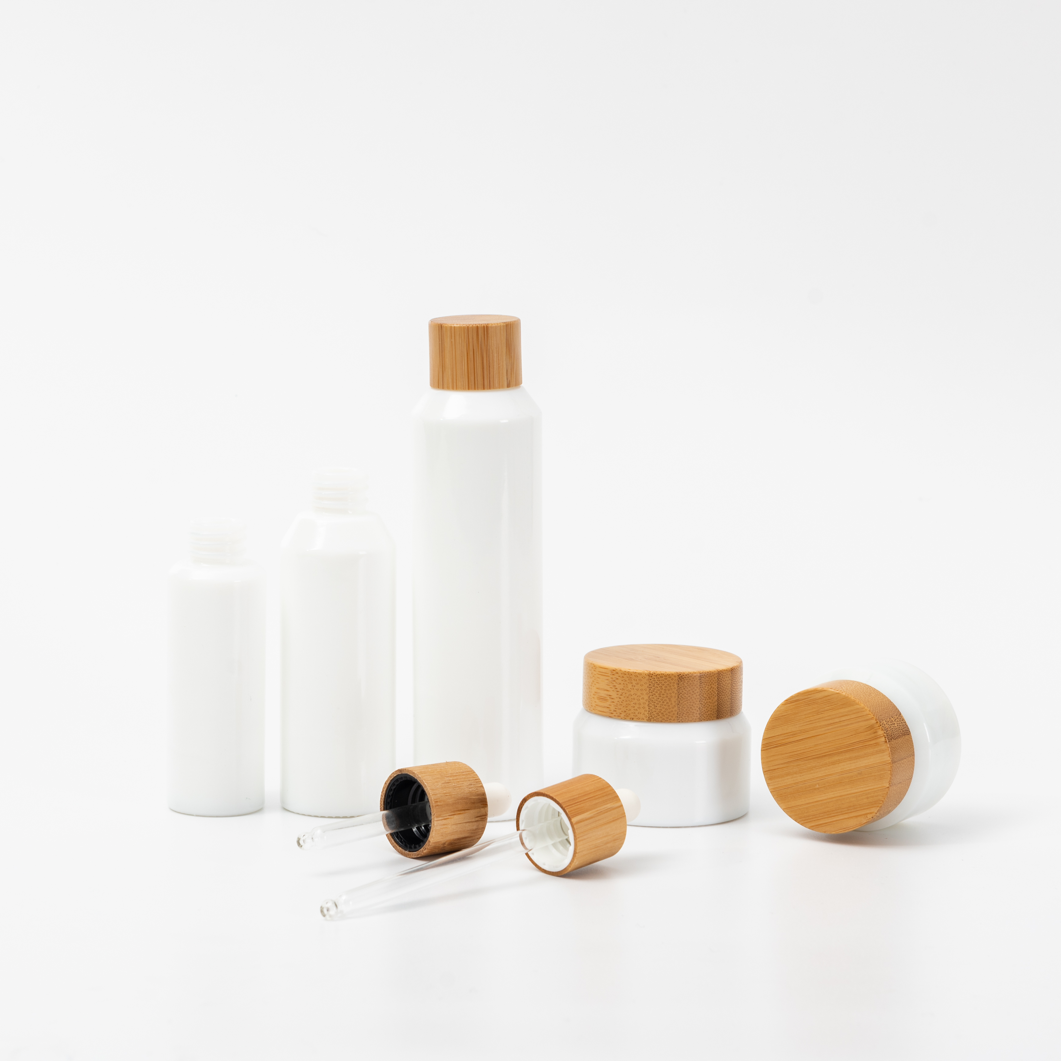 Hot seller opal white glass cosmetic bamboo bottle glass bamboo lid bottle bamboo cream jar