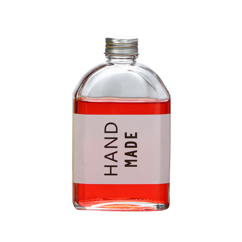 Hot selling 100ml 200ml 250ml 350ml 500ml flat transparent glass juice drink bottle with lid