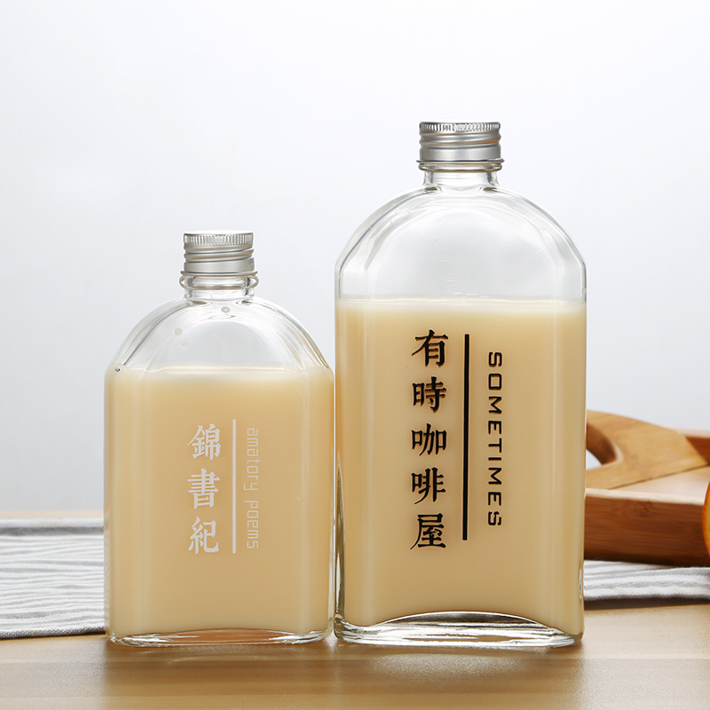 Hot selling 100ml 200ml 250ml 350ml 500ml flat transparent glass juice drink bottle with lid