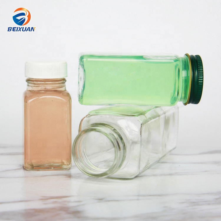 Hot selling 2oz 60ml Clear Glass Shots Square French Mini Bottle with Plastic Screw Cap for Juice Beverage