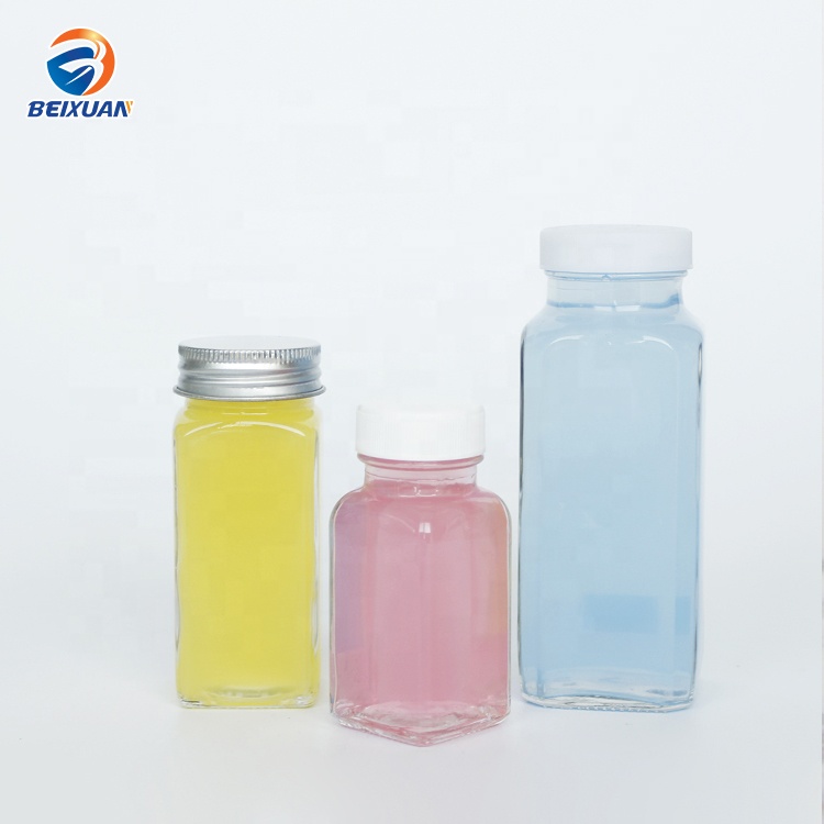 Hot selling 2oz 60ml Clear Glass Shots Square French Mini Bottle with Plastic Screw Cap for Juice Beverage