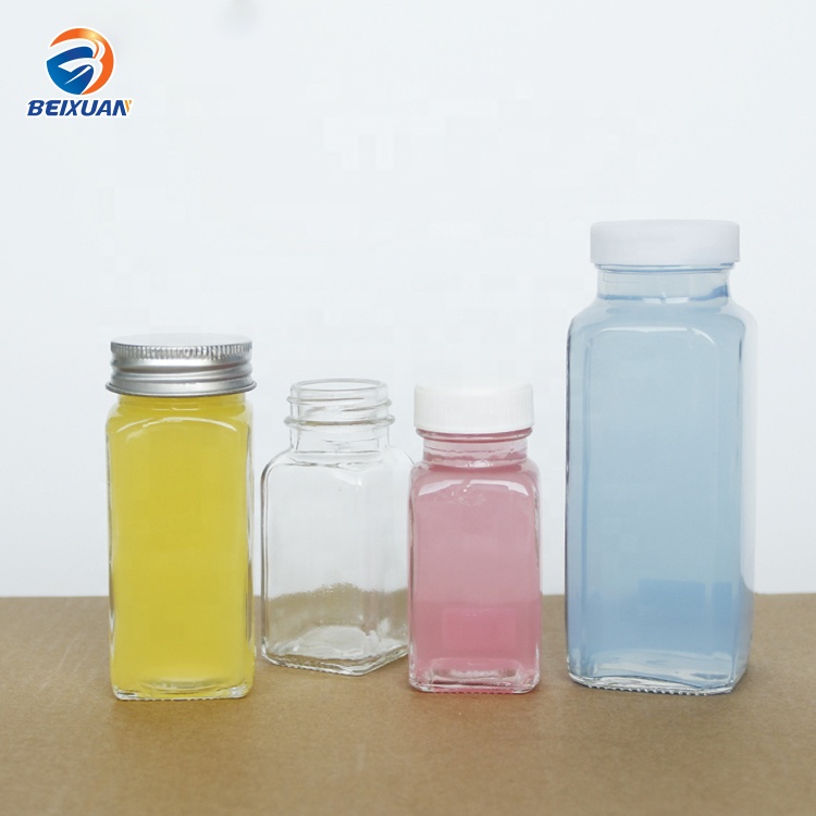 Hot selling 2oz 60ml Clear Glass Shots Square French Mini Bottle with Plastic Screw Cap for Juice Beverage