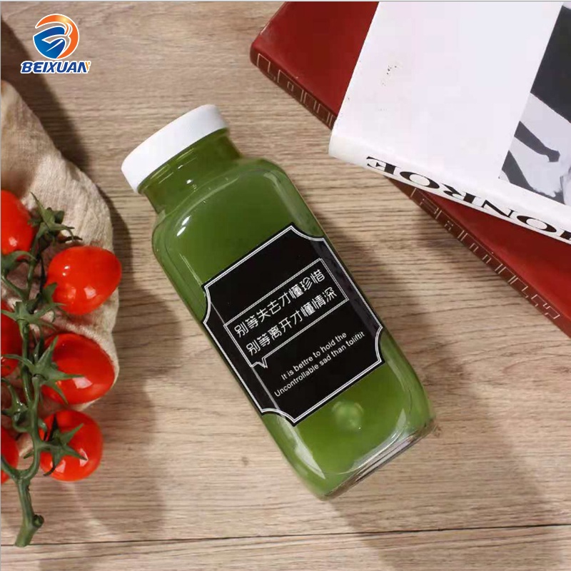 Hot selling 2oz 60ml Clear Glass Shots Square French Mini Bottle with Plastic Screw Cap for Juice Beverage