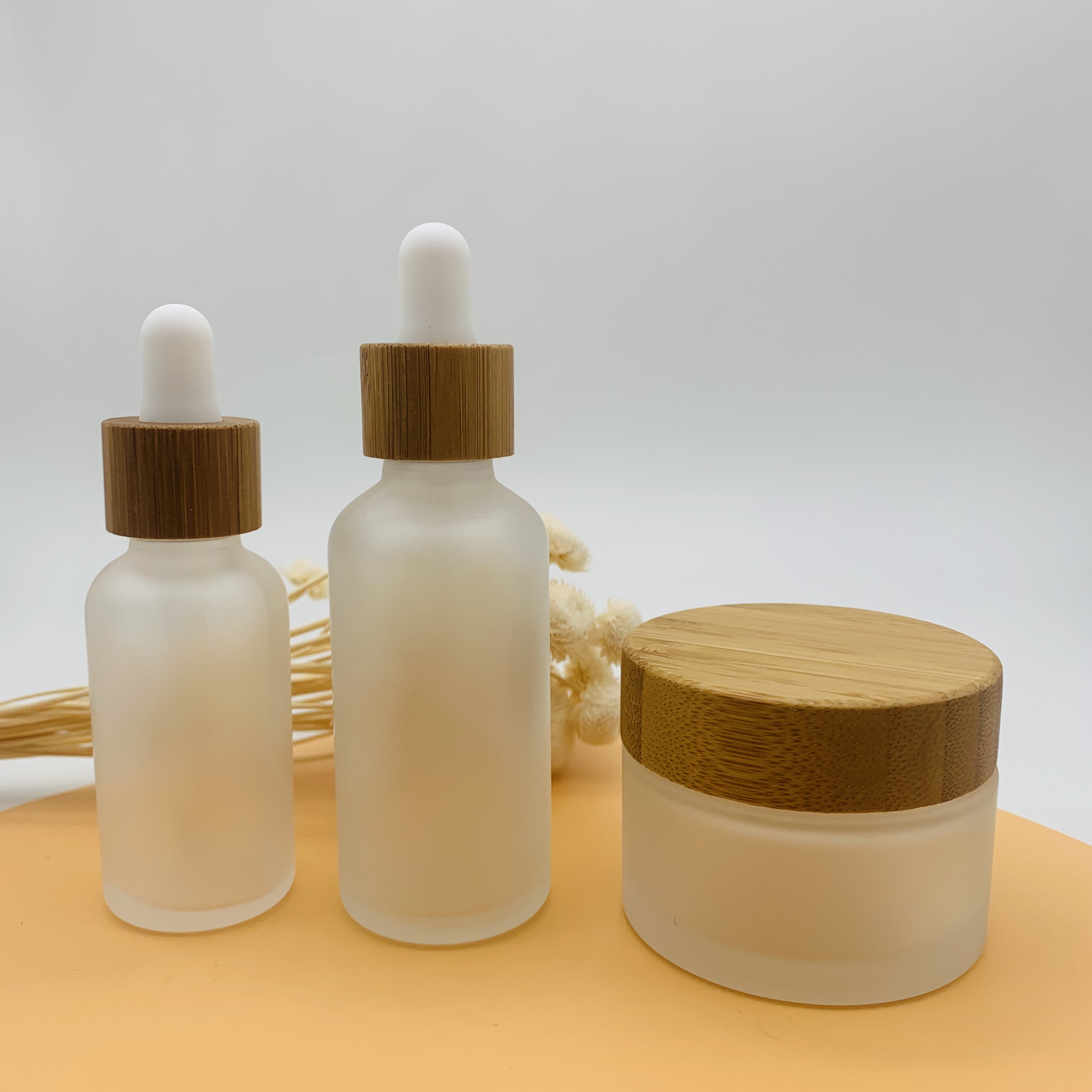 Hot selling 30ml 50ml Essential Oil Glass Dropper Bottle Frosted Glass Bottle with Bamboo Cap