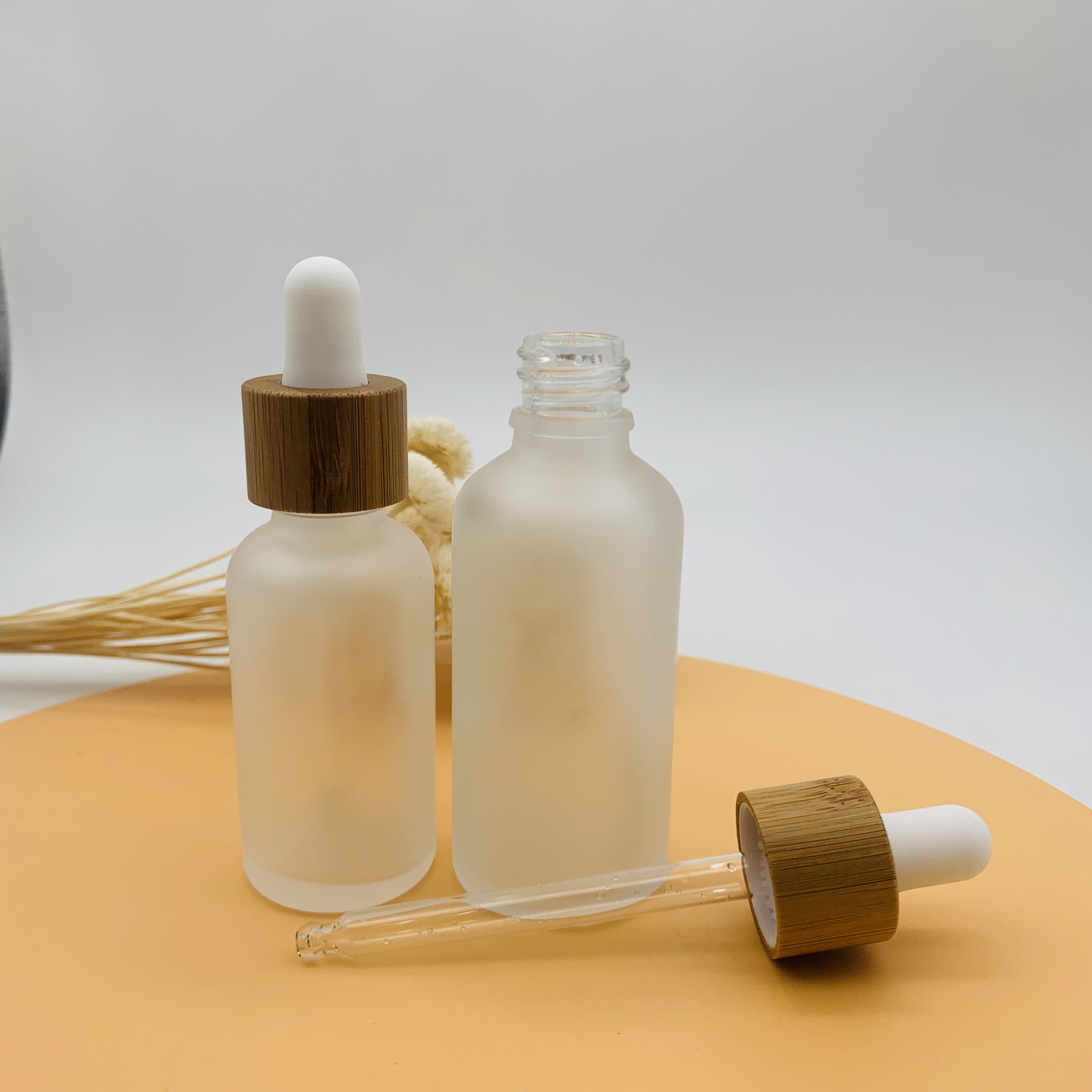 Hot selling 30ml 50ml Essential Oil Glass Dropper Bottle Frosted Glass Bottle with Bamboo Cap