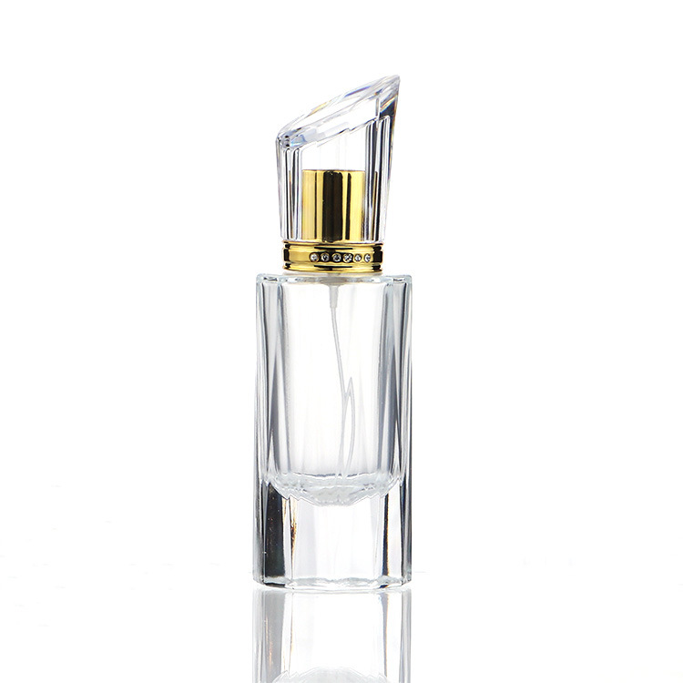 Hot selling 50ml luxury cylindrical spray transparent empty fragrance bottle with gold sprayer for perfume