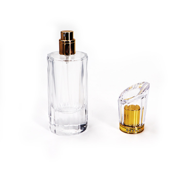 Hot selling 50ml luxury cylindrical spray transparent empty fragrance bottle with gold sprayer for perfume