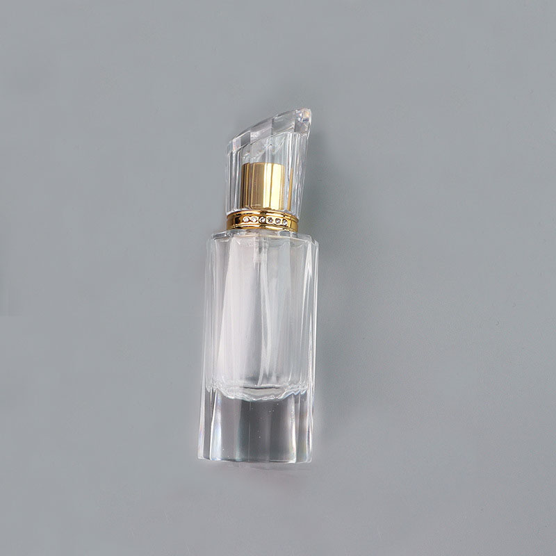 Hot selling 50ml luxury cylindrical spray transparent empty fragrance bottle with gold sprayer for perfume