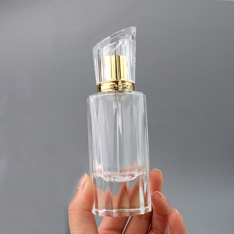 Hot selling 50ml luxury cylindrical spray transparent empty fragrance bottle with gold sprayer for perfume