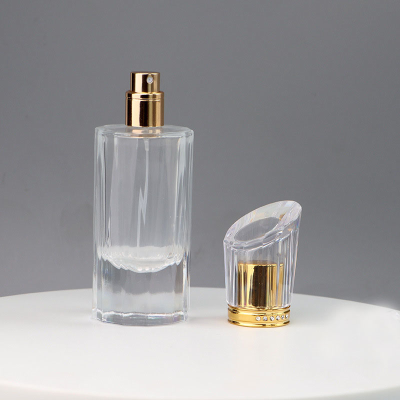 Hot selling 50ml luxury cylindrical spray transparent empty fragrance bottle with gold sprayer for perfume