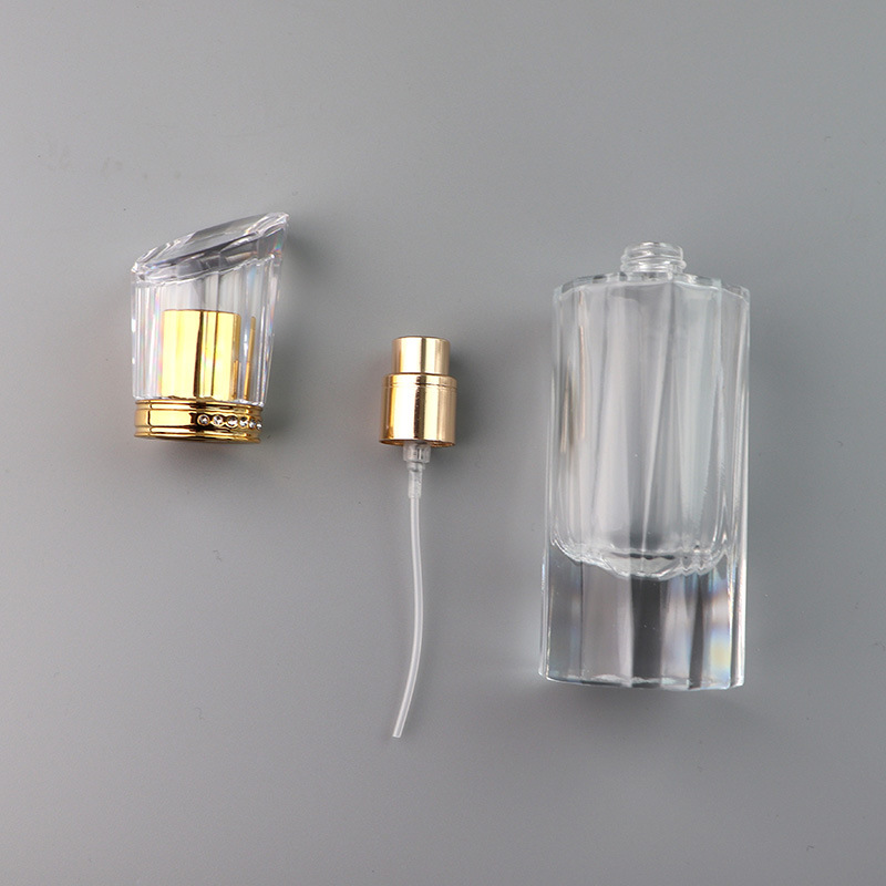 Hot selling 50ml luxury cylindrical spray transparent empty fragrance bottle with gold sprayer for perfume