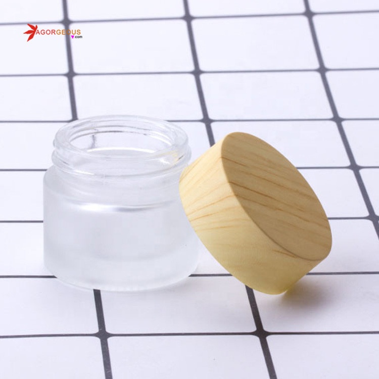 Hot selling 5g 50ml 100ml frosted clear glass cosmetic jar with wood color oem cream bottle