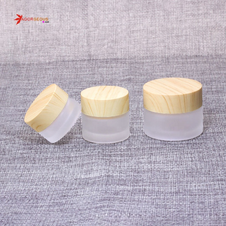 Hot selling 5g 50ml 100ml frosted clear glass cosmetic jar with wood color oem cream bottle