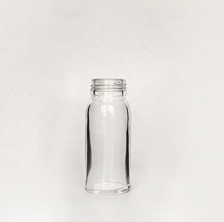 Hot selling clear round glass jar glass bottle for honey and beverage juice with screw lid