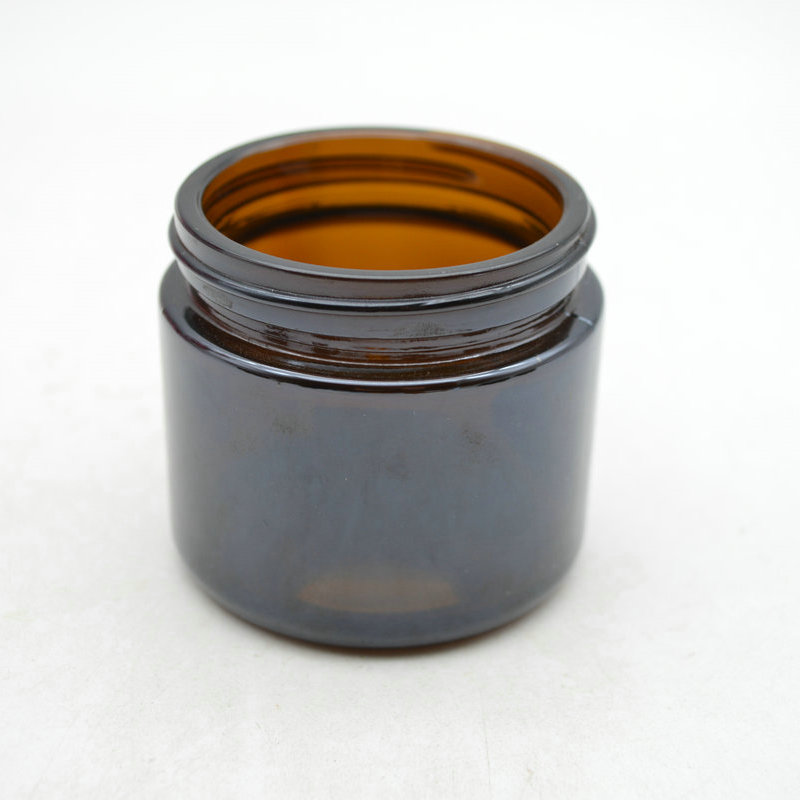 Hot selling custom empty 60g glass cream jar with black cap for lip balm body scrub container