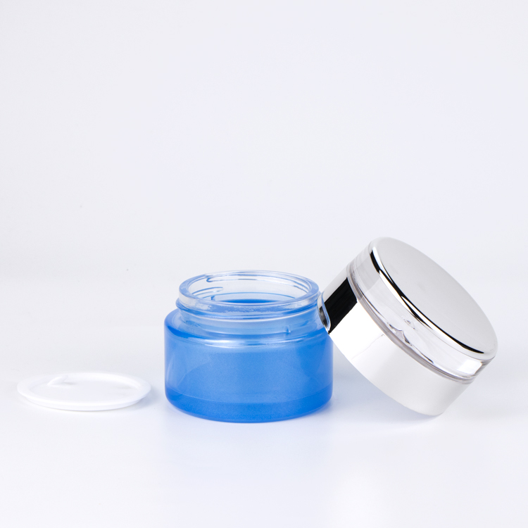 Hotsale Light Blue Transparent Glass Cosmetic Bottle and Jar with Pump and Luxury Water Drop Cap