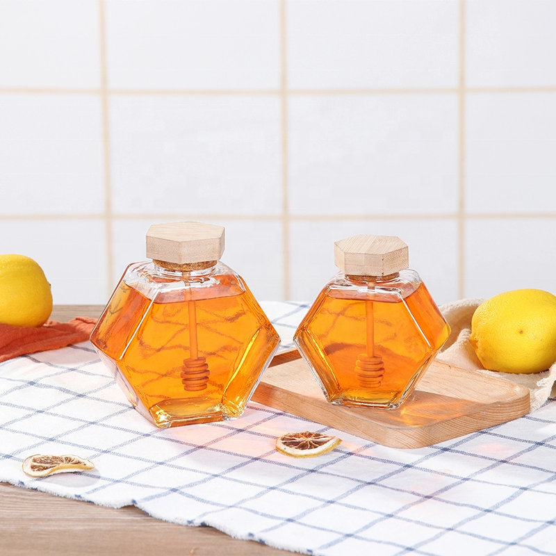 Hotsale hexagonal glass jar with wooden bamboo lid and dipper for honey