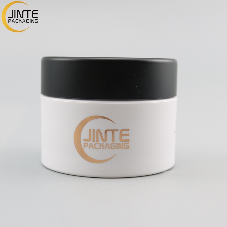Jinte packaging 1ounce Cosmetic containers PETG jar Matte white body with paint black lids for travel samples jars