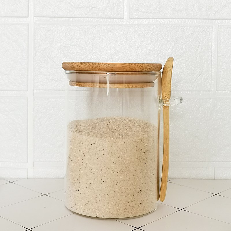 Kitchen storage jar three-piece set with a wooden spoon, a bamboo lid and a glass jar